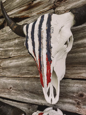 Decorative Ameri can Buffalo skull with 250th American flag design on a wooden background